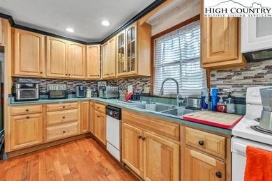 Welcome to 36 Larskpur, a beautiful mountain retreat nestled in on Land Harbor Golf Course in North Carolina - for sale on GolfHomes.com, golf home, golf lot