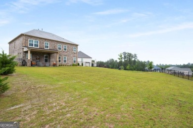 Located in Lakeview-Heron Bay's only gated section-this elegant on Canongate At Heron Bay in Georgia - for sale on GolfHomes.com, golf home, golf lot