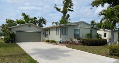 This Casa Grande model home has beautiful golf & water views on Del Tura Golf and Country Club in Florida - for sale on GolfHomes.com, golf home, golf lot