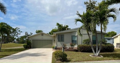 This Casa Grande model home has beautiful golf & water views on Del Tura Golf and Country Club in Florida - for sale on GolfHomes.com, golf home, golf lot