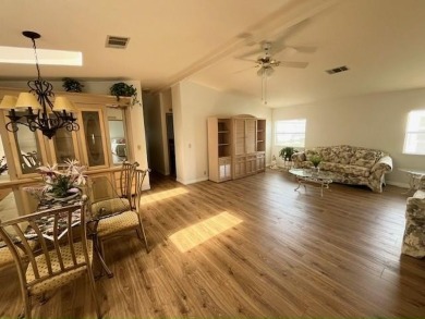 This Casa Grande model home has beautiful golf & water views on Del Tura Golf and Country Club in Florida - for sale on GolfHomes.com, golf home, golf lot