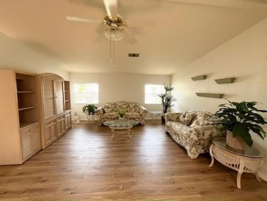 This Casa Grande model home has beautiful golf & water views on Del Tura Golf and Country Club in Florida - for sale on GolfHomes.com, golf home, golf lot