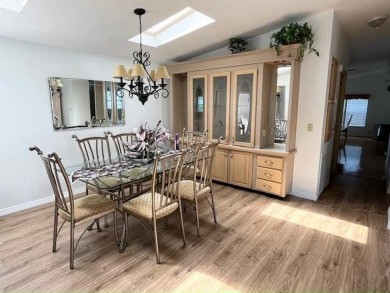 This Casa Grande model home has beautiful golf & water views on Del Tura Golf and Country Club in Florida - for sale on GolfHomes.com, golf home, golf lot