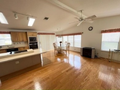 This Casa Grande model home has beautiful golf & water views on Del Tura Golf and Country Club in Florida - for sale on GolfHomes.com, golf home, golf lot