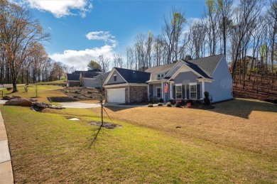 Located in prestigious Woodmont, this ranch style home offers a on Woodmont Golf and Country Club in Georgia - for sale on GolfHomes.com, golf home, golf lot