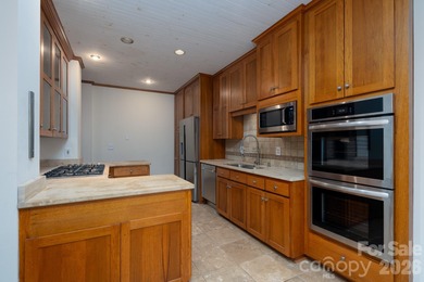 Welcome home to resort living in what feels like your mountain on Old North State Club at Uwharrie Point Golf community in North Carolina - for sale on GolfHomes.com, golf home, golf lot