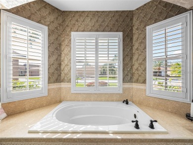 One or more photo(s) has been virtually staged. WATERFRONT on Lake Ashton Golf Club in Florida - for sale on GolfHomes.com, golf home, golf lot