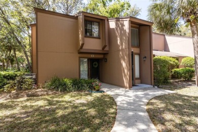Escape to a peaceful, tree-lined oasis in this beautifully on Palm Harbor Golf Club in Florida - for sale on GolfHomes.com, golf home, golf lot