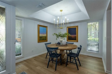 Escape to a peaceful, tree-lined oasis in this beautifully on Palm Harbor Golf Club in Florida - for sale on GolfHomes.com, golf home, golf lot
