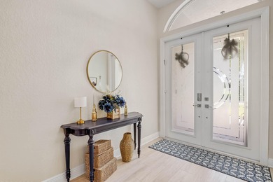 Nestled within a gated community, this spacious split-plan home on Fountains Golf and Country Club in Florida - for sale on GolfHomes.com, golf home, golf lot