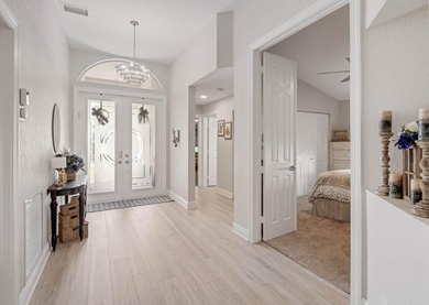 Nestled within a gated community, this spacious split-plan home on Fountains Golf and Country Club in Florida - for sale on GolfHomes.com, golf home, golf lot