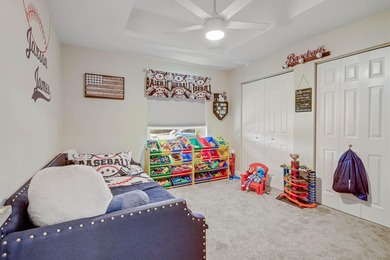 Nestled within a gated community, this spacious split-plan home on Fountains Golf and Country Club in Florida - for sale on GolfHomes.com, golf home, golf lot