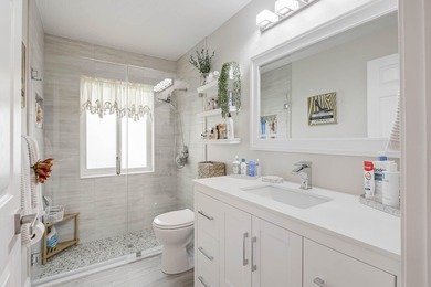 Nestled within a gated community, this spacious split-plan home on Fountains Golf and Country Club in Florida - for sale on GolfHomes.com, golf home, golf lot