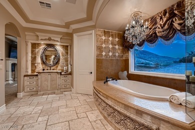 Experience the pinnacle of luxury living in this 8,447 SF on Red Rock Country Club in Nevada - for sale on GolfHomes.com, golf home, golf lot