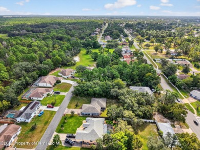 BUILD YOUR DREAM HOME on this spacious 0.40-acre CORNER lot on Oak Hills Country Club in Florida - for sale on GolfHomes.com, golf home, golf lot