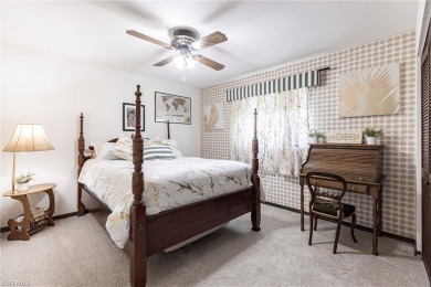 Wake up to sweeping golf course views in this distinctive on Palmetto-Pine Country Club in Florida - for sale on GolfHomes.com, golf home, golf lot