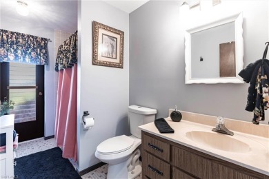 Wake up to sweeping golf course views in this distinctive on Palmetto-Pine Country Club in Florida - for sale on GolfHomes.com, golf home, golf lot