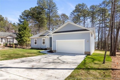 Stunning new construction located in the sought-after, guarded on Carolina Trace Country Club in North Carolina - for sale on GolfHomes.com, golf home, golf lot