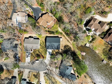 Beautiful new construction waterfront home located in the on Carolina Trace Country Club in North Carolina - for sale on GolfHomes.com, golf home, golf lot