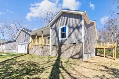 Beautiful new construction waterfront home located in the on Carolina Trace Country Club in North Carolina - for sale on GolfHomes.com, golf home, golf lot