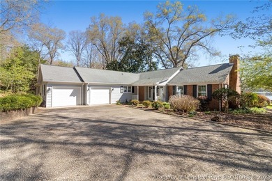 Stunning lakefront living awaits at 253 Lakeview Dr in the on Carolina Trace Country Club in North Carolina - for sale on GolfHomes.com, golf home, golf lot