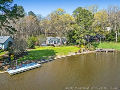 Stunning lakefront living awaits at 253 Lakeview Dr in the on Carolina Trace Country Club in North Carolina - for sale on GolfHomes.com, golf home, golf lot