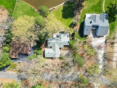 Stunning lakefront living awaits at 253 Lakeview Dr in the on Carolina Trace Country Club in North Carolina - for sale on GolfHomes.com, golf home, golf lot