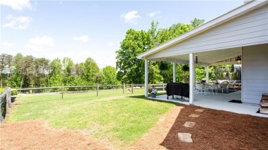 Hampton Golf Village! Stunning 3 sided brick home features the on Hampton Golf Village in Georgia - for sale on GolfHomes.com, golf home, golf lot