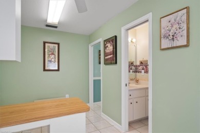 This *LARGER THAN IT LOOKS* 3 bedroom, 2.5 bath, oversized 2-car on  in Florida - for sale on GolfHomes.com, golf home, golf lot