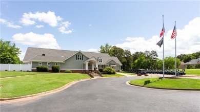 Hampton Golf Village! Stunning 3 sided brick home features the on Hampton Golf Village in Georgia - for sale on GolfHomes.com, golf home, golf lot