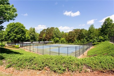 Hampton Golf Village! Stunning 3 sided brick home features the on Hampton Golf Village in Georgia - for sale on GolfHomes.com, golf home, golf lot