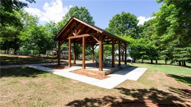 Hampton Golf Village! Stunning 3 sided brick home features the on Hampton Golf Village in Georgia - for sale on GolfHomes.com, golf home, golf lot