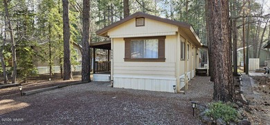 Tucked among the tall pines of Pinetop Lakes Country Club, this on Pinetop Lakes Golf and Country Club in Arizona - for sale on GolfHomes.com, golf home, golf lot