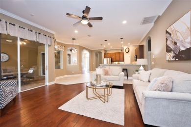 Stunning 4-Bedroom Pool Home with Office  Bonus Room in Gated on Heritage Isles Golf and Country Club in Florida - for sale on GolfHomes.com, golf home, golf lot