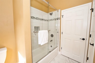 Stunning 4-Bedroom Pool Home with Office  Bonus Room in Gated on Heritage Isles Golf and Country Club in Florida - for sale on GolfHomes.com, golf home, golf lot