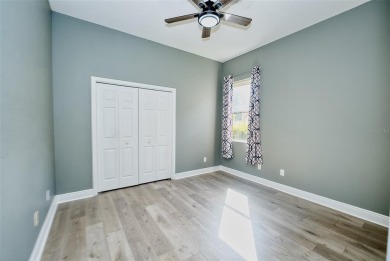 Stunning 4-Bedroom Pool Home with Office  Bonus Room in Gated on Heritage Isles Golf and Country Club in Florida - for sale on GolfHomes.com, golf home, golf lot