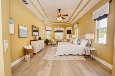Stunning 4-Bedroom Pool Home with Office  Bonus Room in Gated on Heritage Isles Golf and Country Club in Florida - for sale on GolfHomes.com, golf home, golf lot