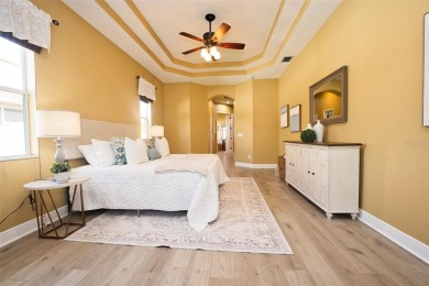 Stunning 4-Bedroom Pool Home with Office  Bonus Room in Gated on Heritage Isles Golf and Country Club in Florida - for sale on GolfHomes.com, golf home, golf lot