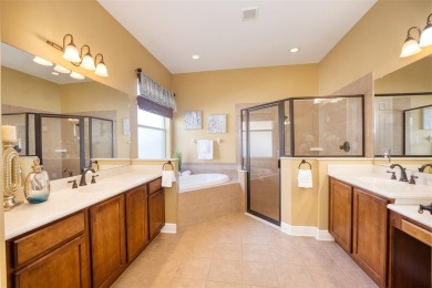 Stunning 4-Bedroom Pool Home with Office  Bonus Room in Gated on Heritage Isles Golf and Country Club in Florida - for sale on GolfHomes.com, golf home, golf lot