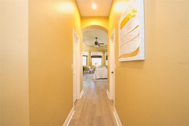 Stunning 4-Bedroom Pool Home with Office  Bonus Room in Gated on Heritage Isles Golf and Country Club in Florida - for sale on GolfHomes.com, golf home, golf lot