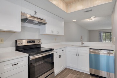 Welcome home to this beautifully updated second-floor condo on East Lake Woodlands Country Club in Florida - for sale on GolfHomes.com, golf home, golf lot