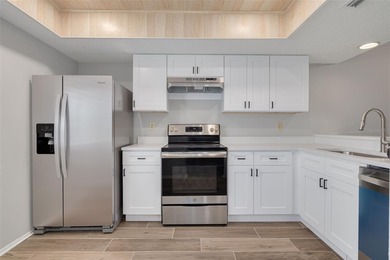 Welcome home to this beautifully updated second-floor condo on East Lake Woodlands Country Club in Florida - for sale on GolfHomes.com, golf home, golf lot