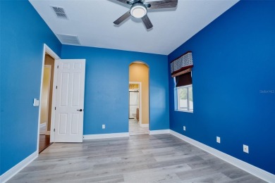 Stunning 4-Bedroom Pool Home with Office  Bonus Room in Gated on Heritage Isles Golf and Country Club in Florida - for sale on GolfHomes.com, golf home, golf lot