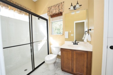 Stunning 4-Bedroom Pool Home with Office  Bonus Room in Gated on Heritage Isles Golf and Country Club in Florida - for sale on GolfHomes.com, golf home, golf lot
