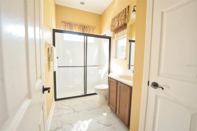 Stunning 4-Bedroom Pool Home with Office  Bonus Room in Gated on Heritage Isles Golf and Country Club in Florida - for sale on GolfHomes.com, golf home, golf lot