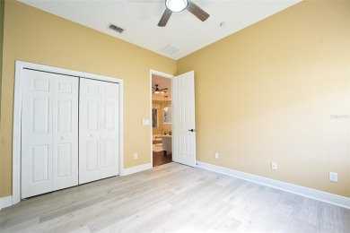 Stunning 4-Bedroom Pool Home with Office  Bonus Room in Gated on Heritage Isles Golf and Country Club in Florida - for sale on GolfHomes.com, golf home, golf lot