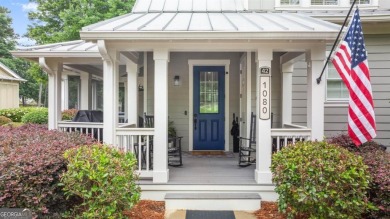 Welcome to this charming 3-bedroom, 3.5-bathroom Landing cottage on Reynolds Lake Oconee - The Landing in Georgia - for sale on GolfHomes.com, golf home, golf lot