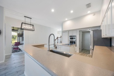 Welcome to this beautifully updated 4-bedroom, 3-bath home in on River Wilderness Golf and Country Club in Florida - for sale on GolfHomes.com, golf home, golf lot