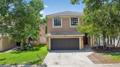 Spacious 5BR, 2.5BA home in Madison Green, Royal Palm Beach on The Links At Madison Green in Florida - for sale on GolfHomes.com, golf home, golf lot