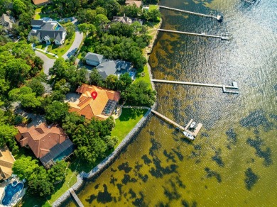 WESTWARD-FACING SINGLE-STORY WATERFRONT ESTATE WITHIN ESTEEMED on Kelly Plantation Golf Club in Florida - for sale on GolfHomes.com, golf home, golf lot